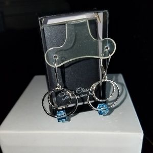 Sterling Silver earrings with blue accent.